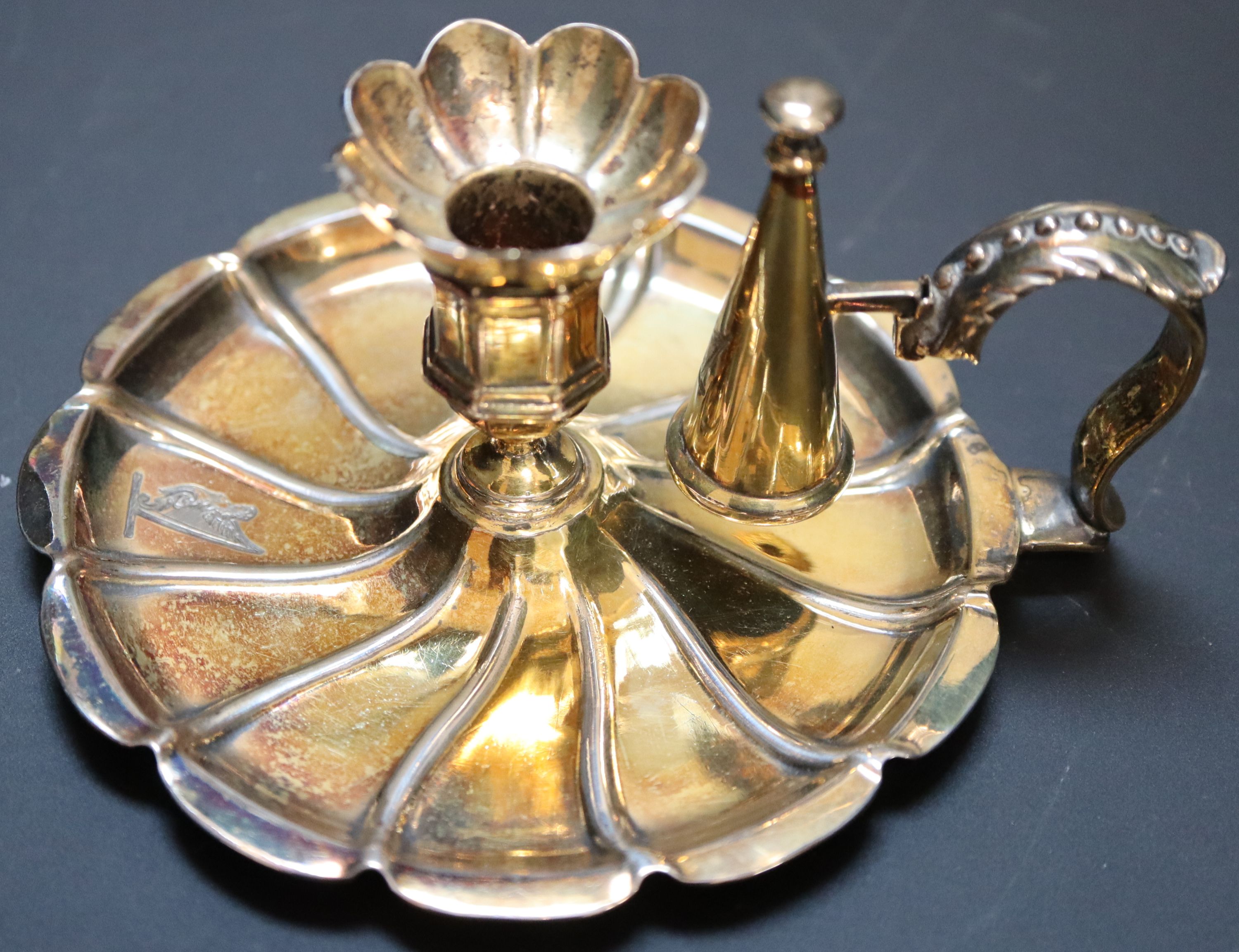 A Victorian silver gilt miniature chamberstick, height 6.5cm, 4oz.
